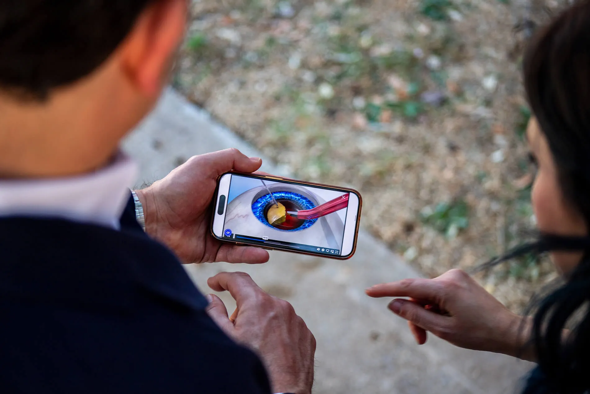 Dr. Sarkisian and Amy watching a video on the phone