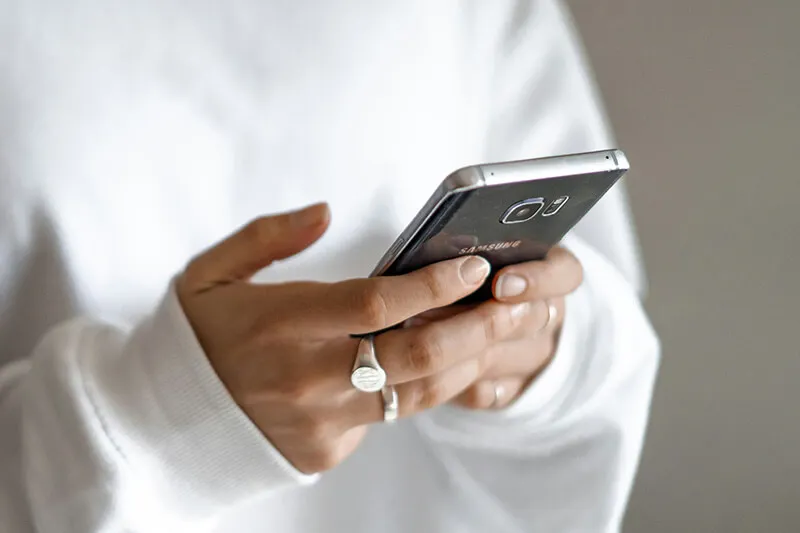 Resources - Portal Person holding smartphone