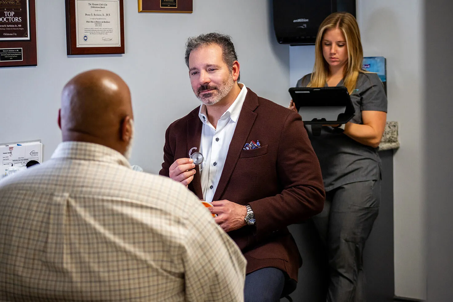 Reviews Intro Dr. Sarkisian talking to a patient