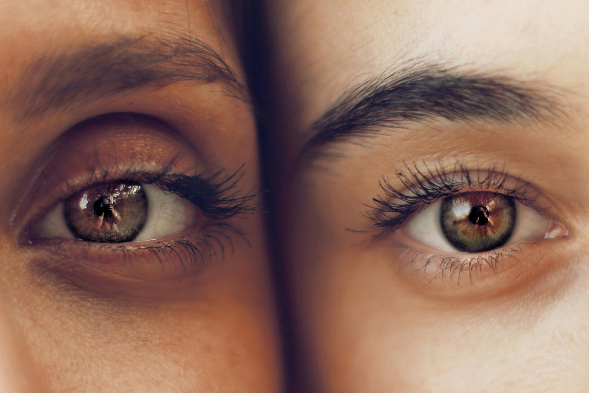 Close up of two people with brown eyes