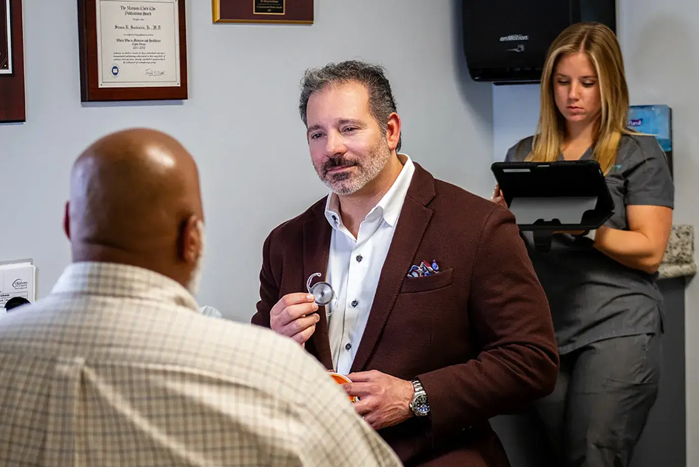 Dr. Sarkisian talking to a patient about lens options