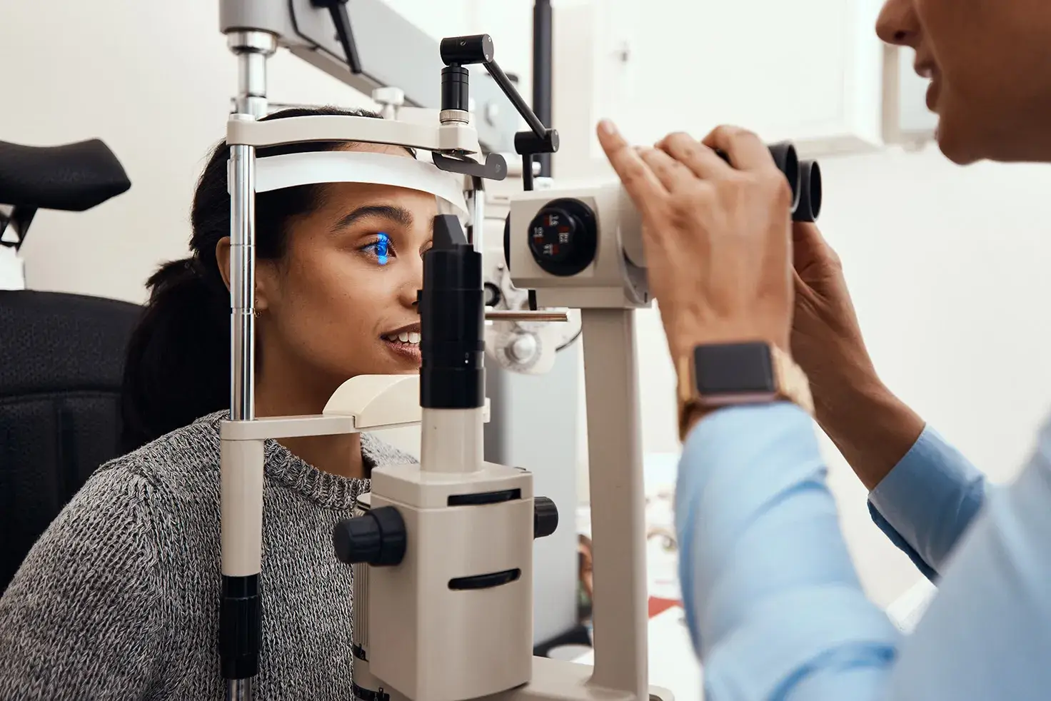 Ophthalmology Clinic Doctors Woman smiling during eye examination