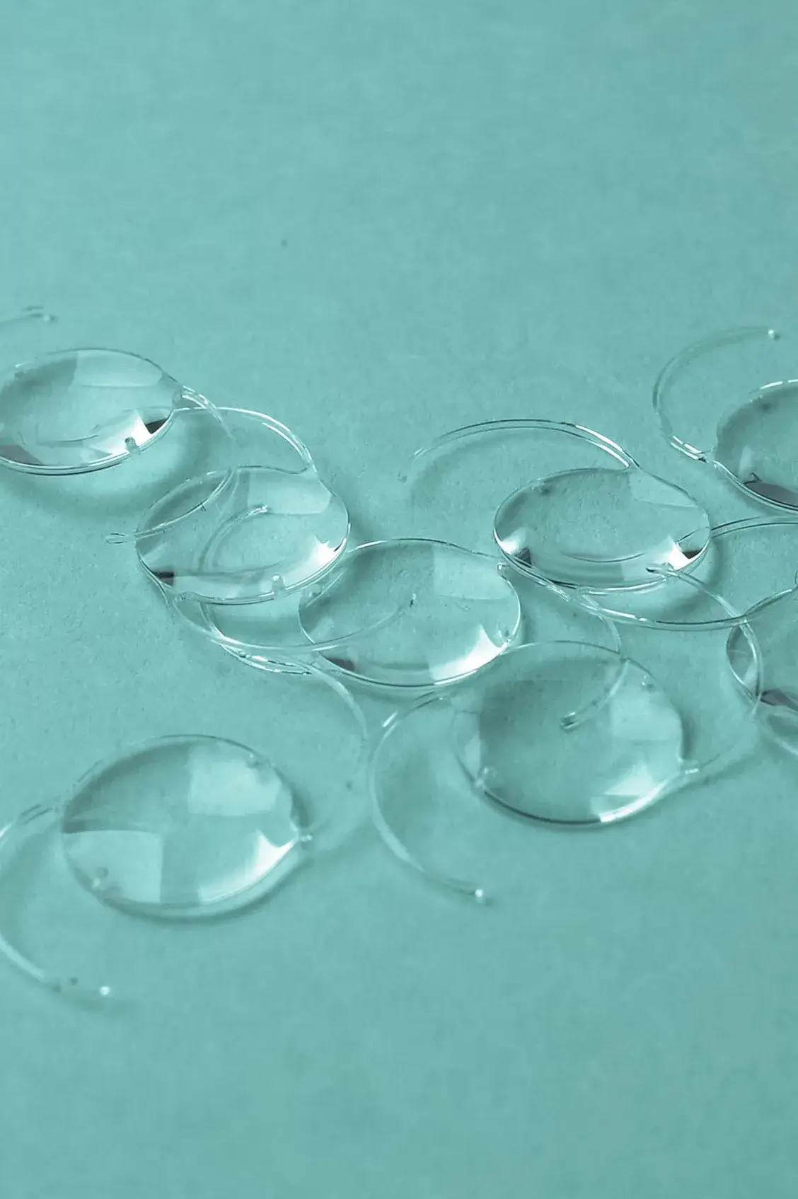 IOLs on teal background